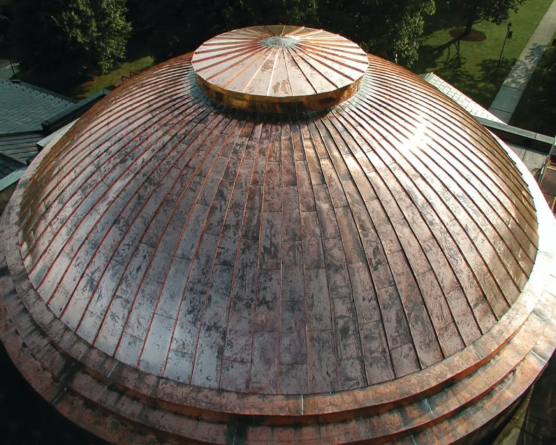 Craftsman Roofing crew installing a new roof in Macomb